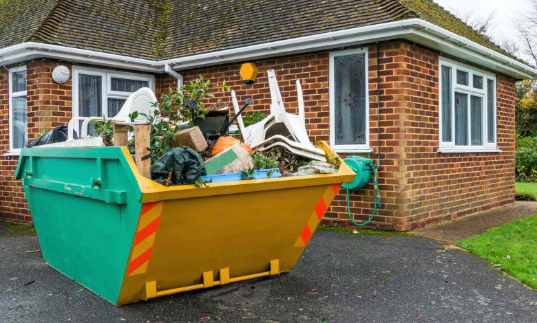 Skip bins in house backyard