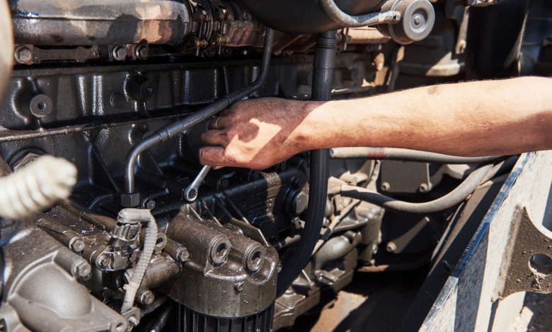 a mechanic checking car reconditioned cylinder head